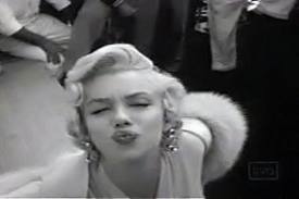 Marilyn Monroe blows a kiss